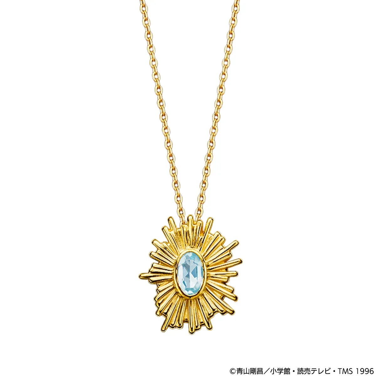 金色のネックレス。太陽のようなデザインのペンダントトップには、水色の宝石が埋め込まれている