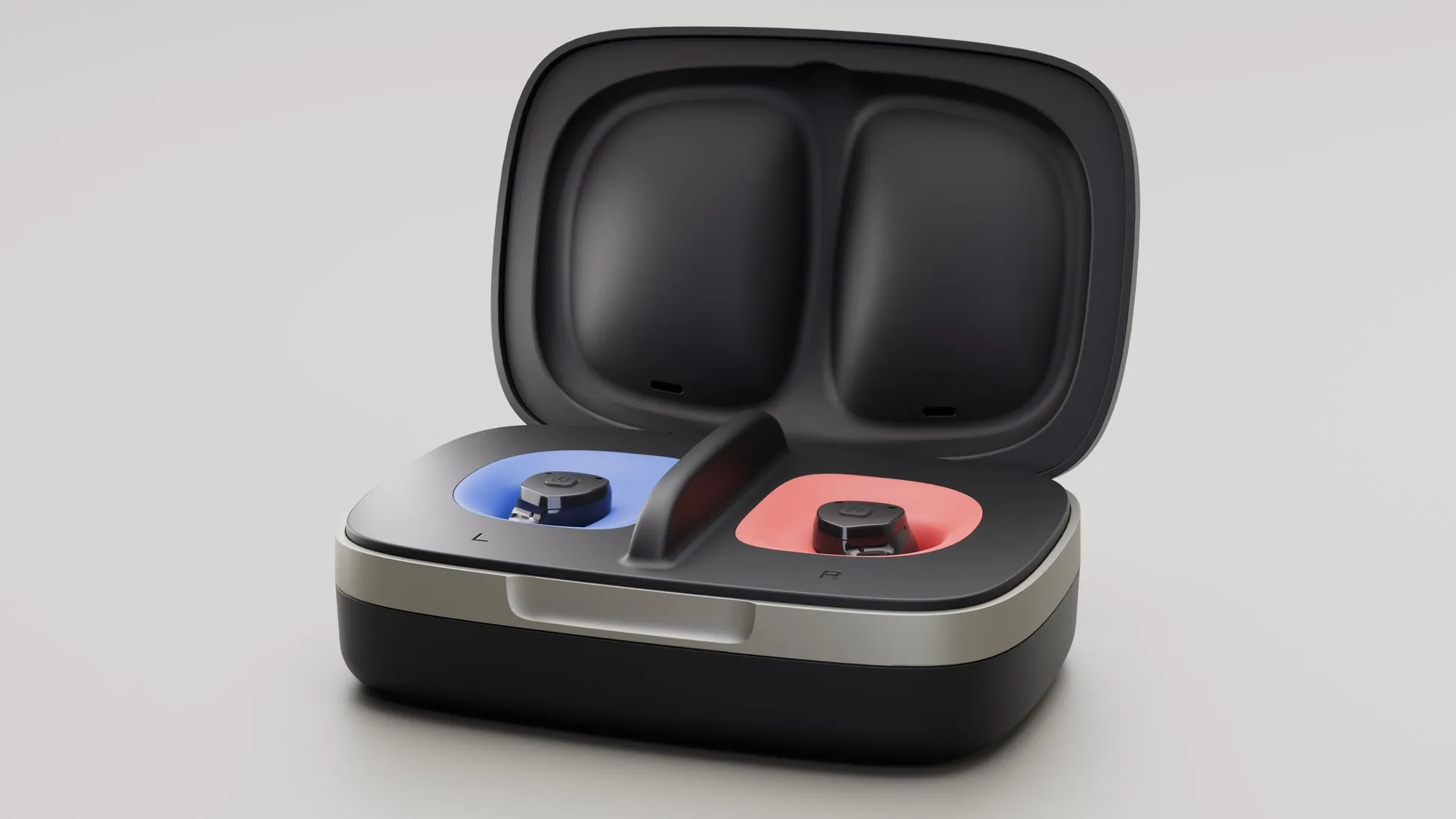 ワイヤレスイヤホンの充電ケースが開いた状態で写っており、左右のイヤホンが青と赤の異なる色のスロットに収納されています。モダンでシンプルなデザインの電子機器です。