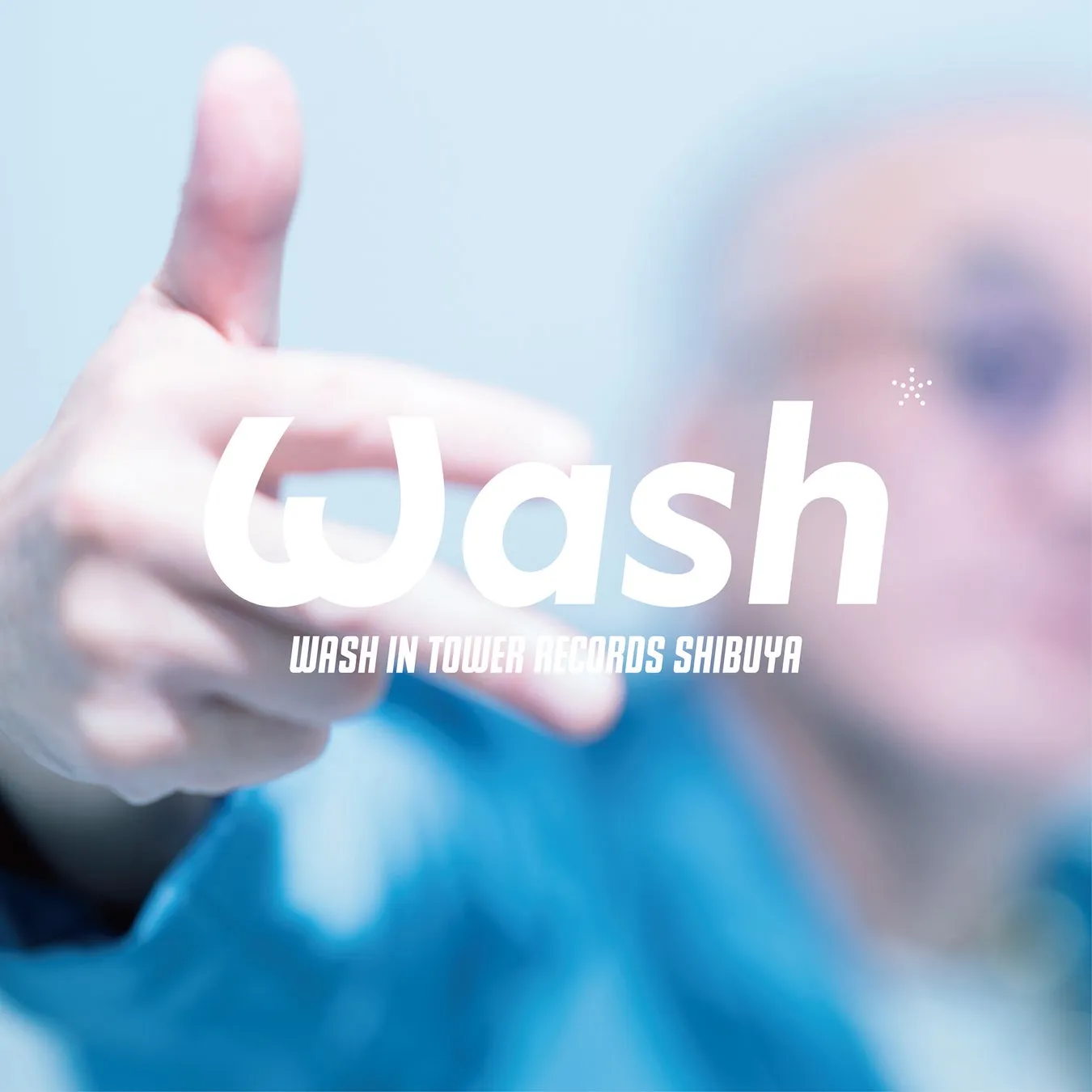 指をさすようなポーズのロゴと「Wash」の文字のステッカー。