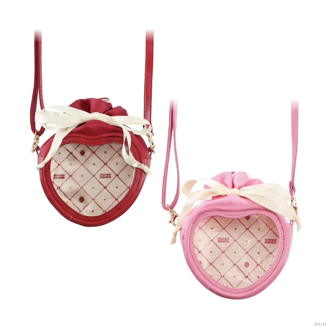 2つのハート型のショルダーバッグ。左は赤、右はピンク。どちらも白いリボンと透明な窓が付いている.